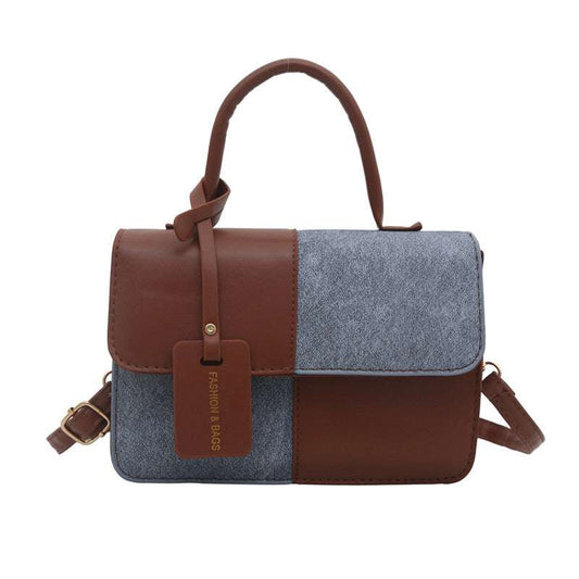 Small bag in pebbled PU leather with zipper, multiple pockets, and adjustable strap available in six colors