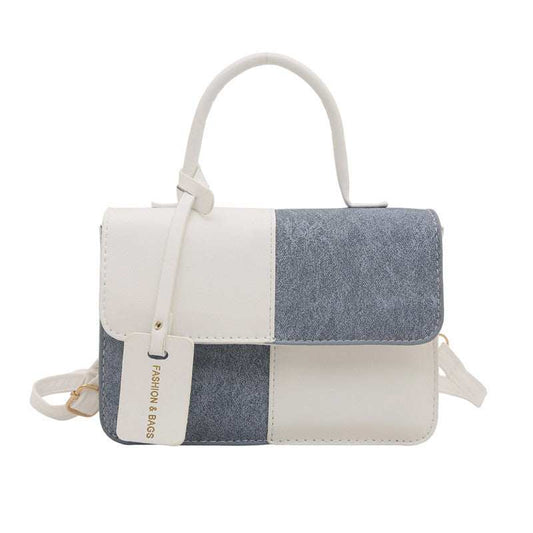 Small bag in pebbled PU leather with zipper, multiple pockets, and adjustable strap available in six colors