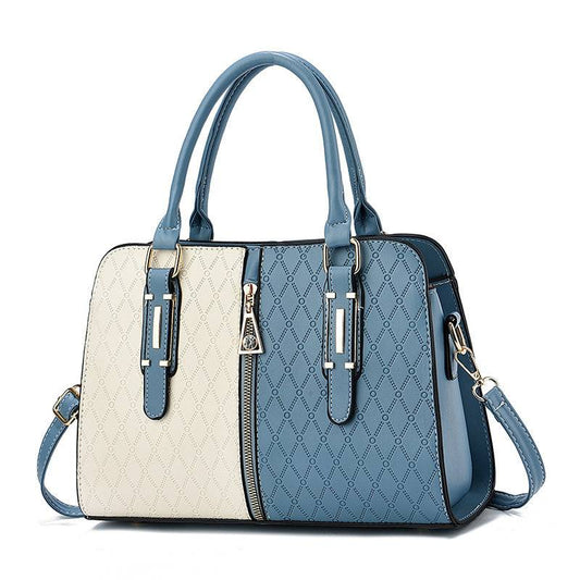 Color-blocked PU Rimini bag with adjustable strap and zipper closure in multiple colors