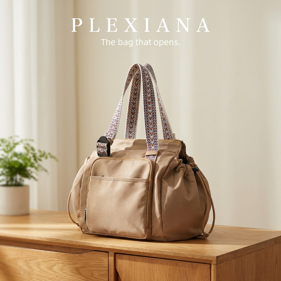 Plexiana bag on a wooden sideboard showing the front zip pocket